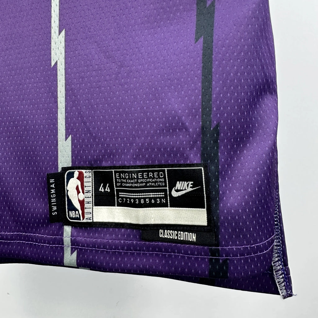Toronto Raptors 2025-26 throwback edition basketball jersey full length back angle view in white for basketball fans