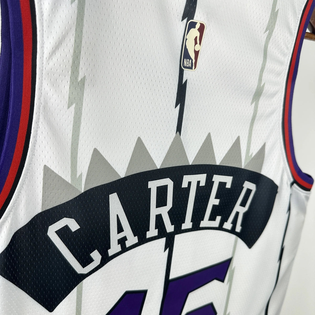 Toronto Raptors 2025-26 throwback edition basketball jersey detailed side view in white for basketball fans