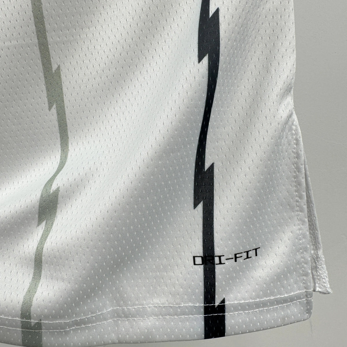 Toronto Raptors 2025-26 throwback edition basketball jersey close-up of moisture-wicking fabric texture in white for basketball fans