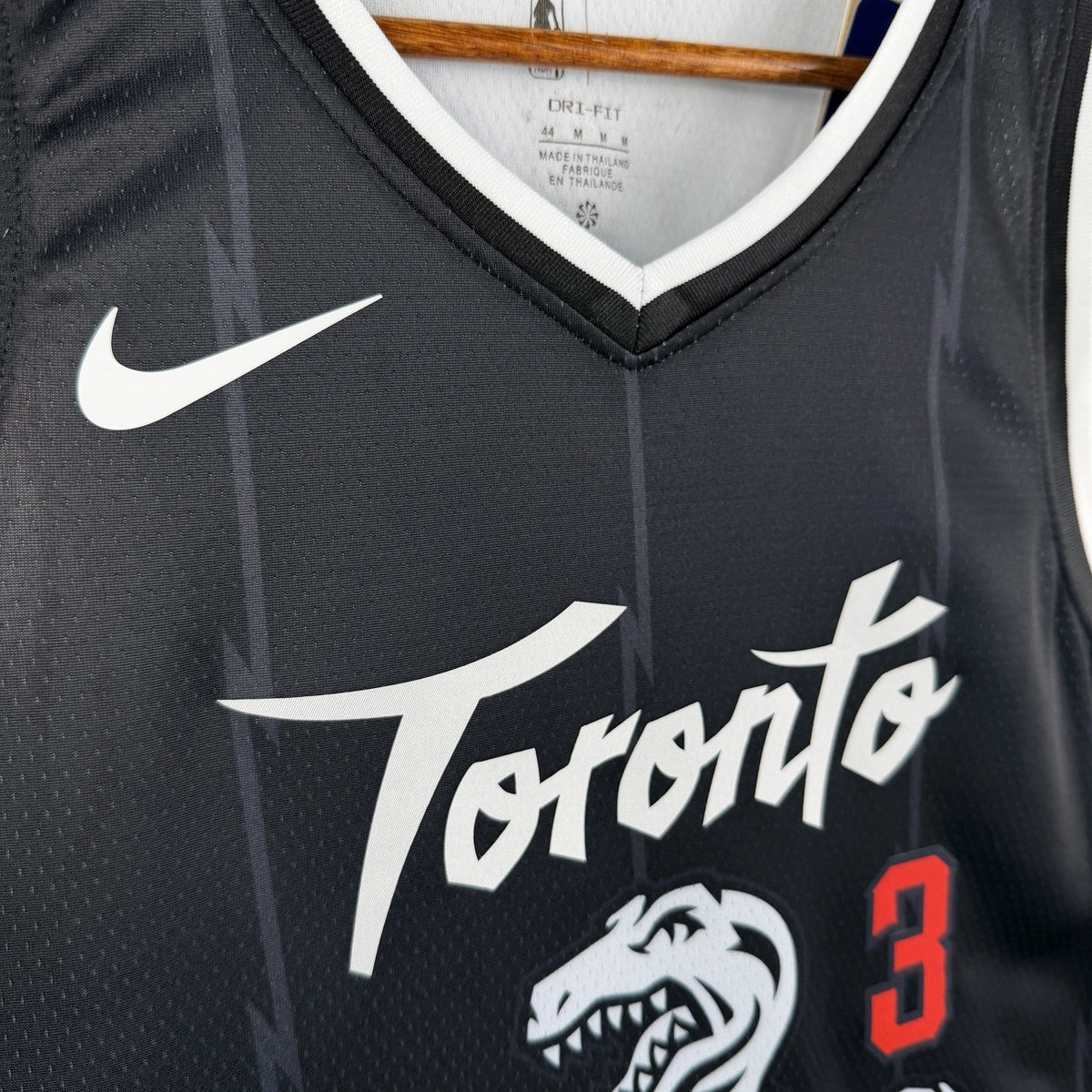 Toronto Raptors 2025-26 city edition basketball jersey close-up of collar and neckline stitching in team colors for basketball fans