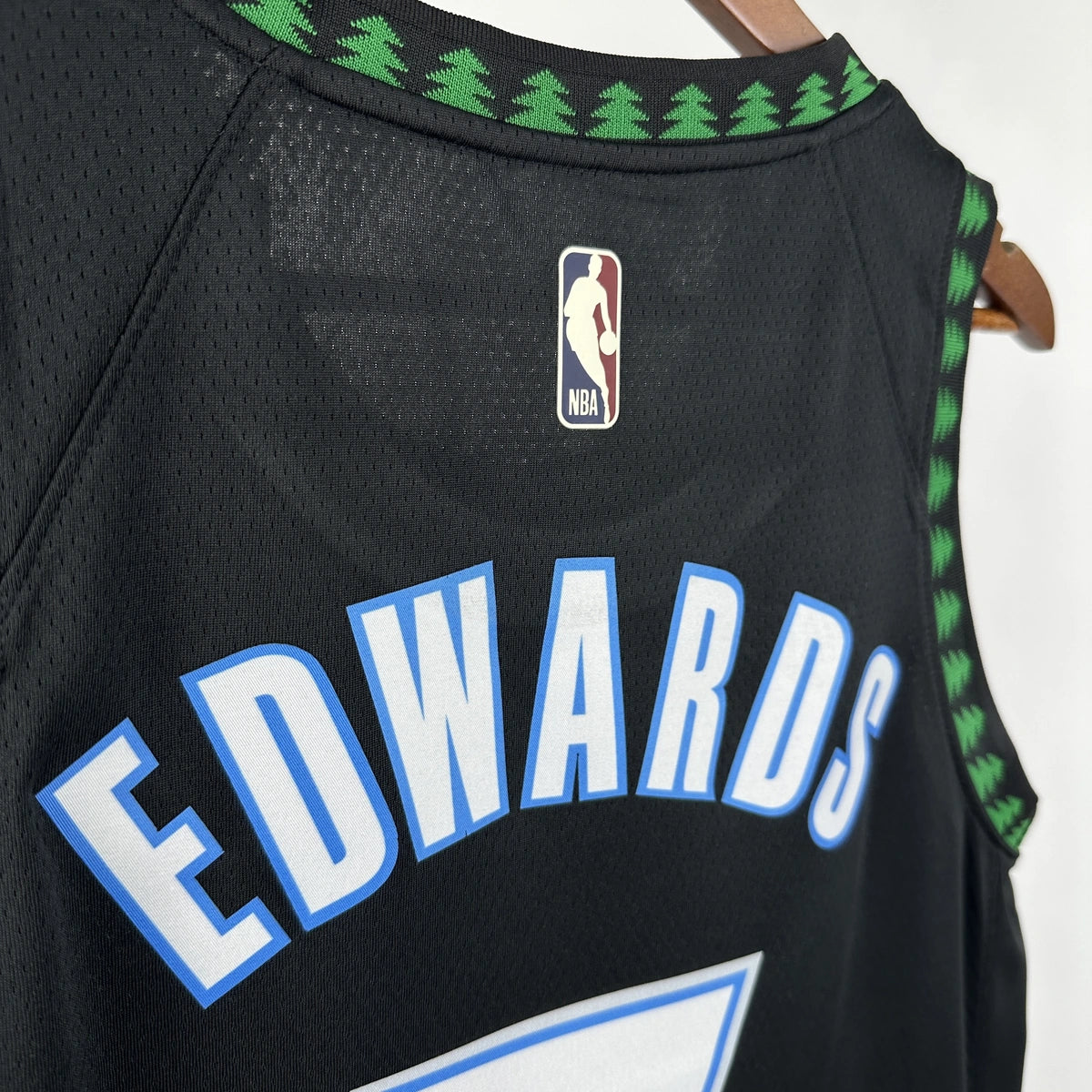 Minnesota Timberwolves 2025-26 throwback edition basketball jersey close-up of moisture-wicking fabric texture in team colors for basketball fans