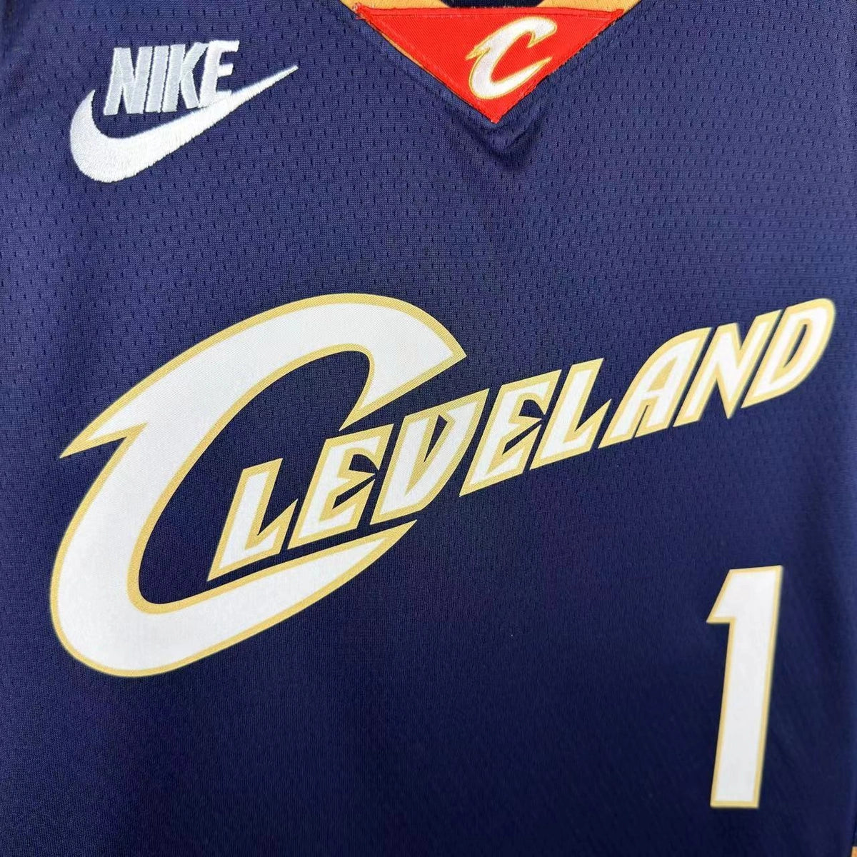 Cleveland Cavaliers 2025-26 throwback edition basketball jersey close-up of collar and neckline stitching in team colors for basketball fans