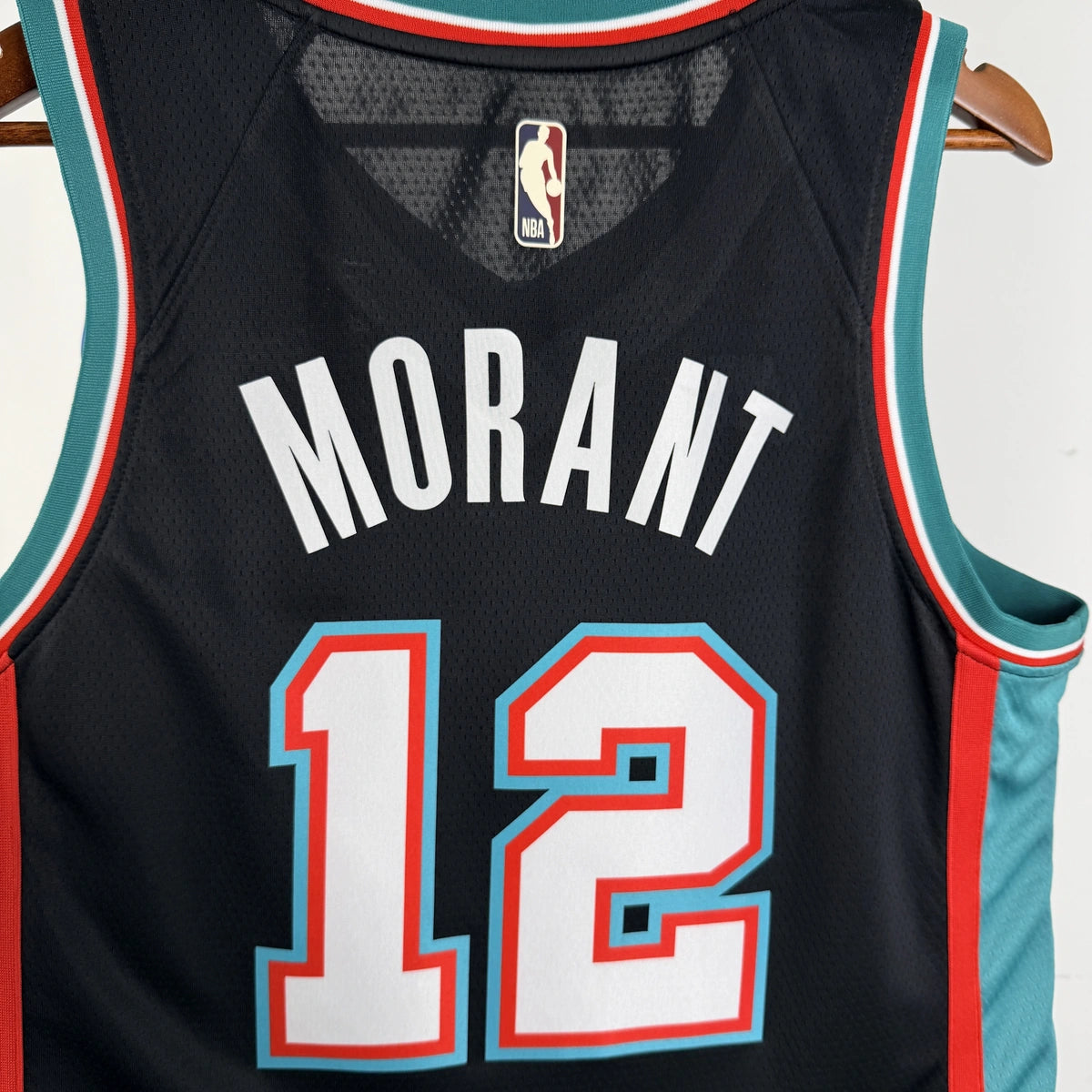 Memphis Grizzlies 2025-26 throwback edition basketball jersey close-up of moisture-wicking fabric texture in team colors for basketball fans