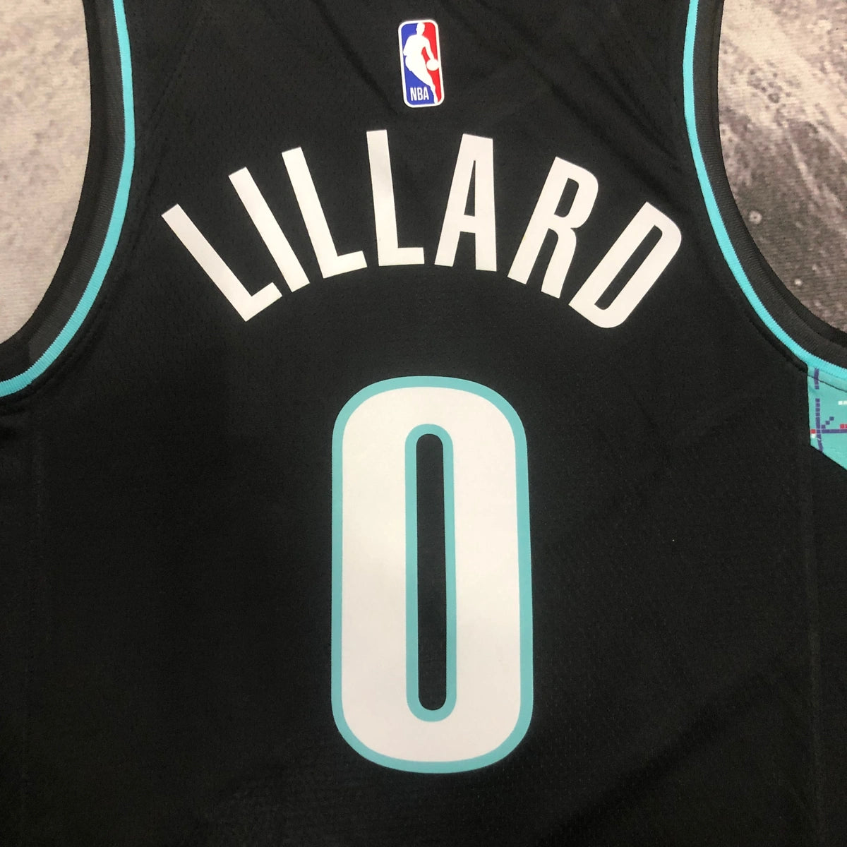 Portland Trail Blazers 2025-26 away basketball jersey close-up of jock tag and hem details in black for basketball fans