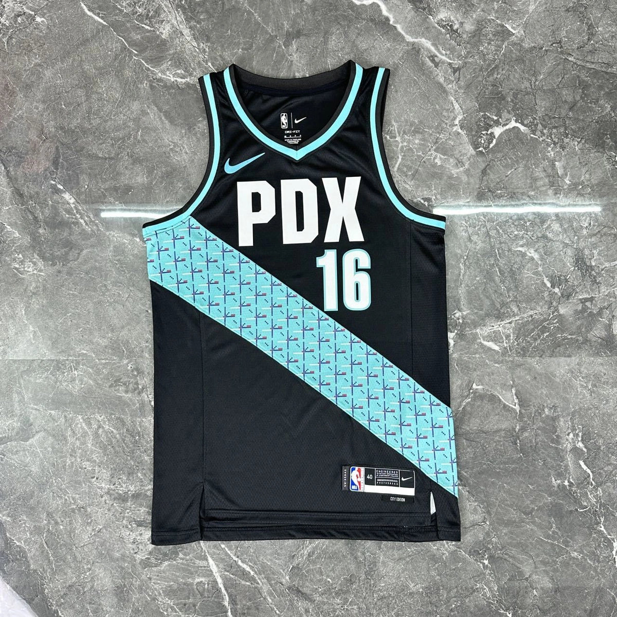 Portland Trail Blazers 2025-26 city edition basketball jersey angled back view in team colors for basketball fans
