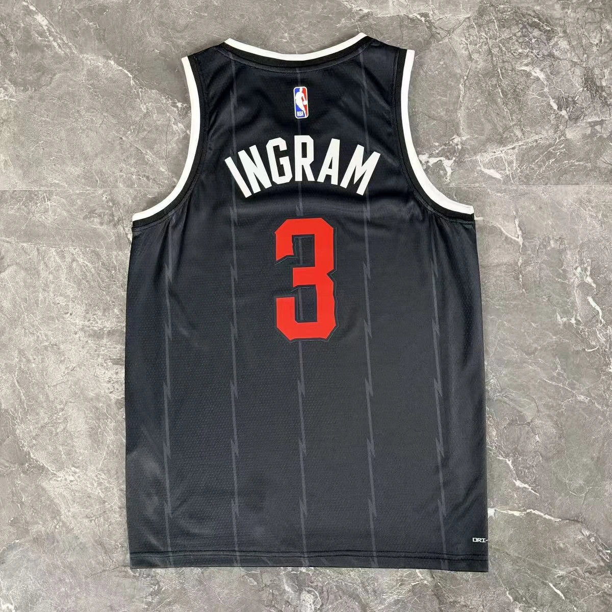 Toronto Raptors 2025-26 city edition basketball jersey close-up of moisture-wicking fabric texture in team colors for basketball fans