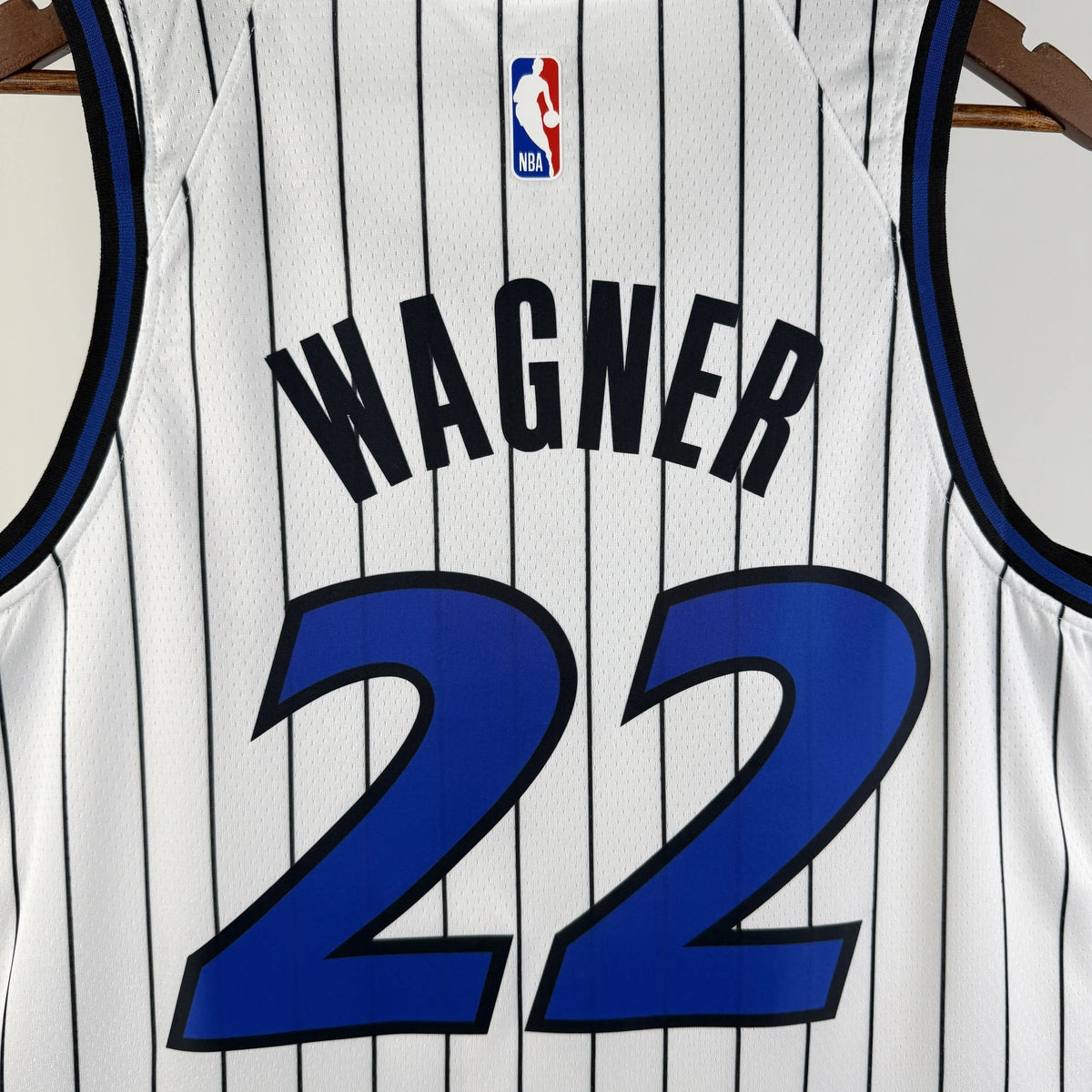 Orlando Magic 2025-26 home basketball jersey angled front view in white for basketball fans