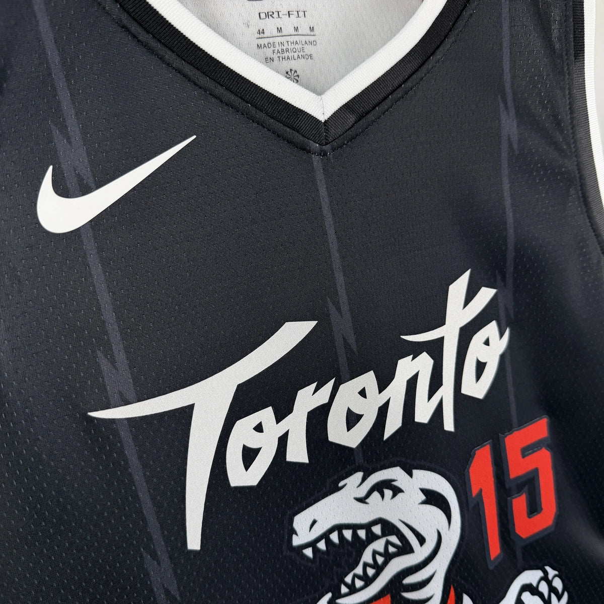 Toronto Raptors 2025-26 city edition basketball jersey close-up of jock tag and hem details in team colors for basketball fans