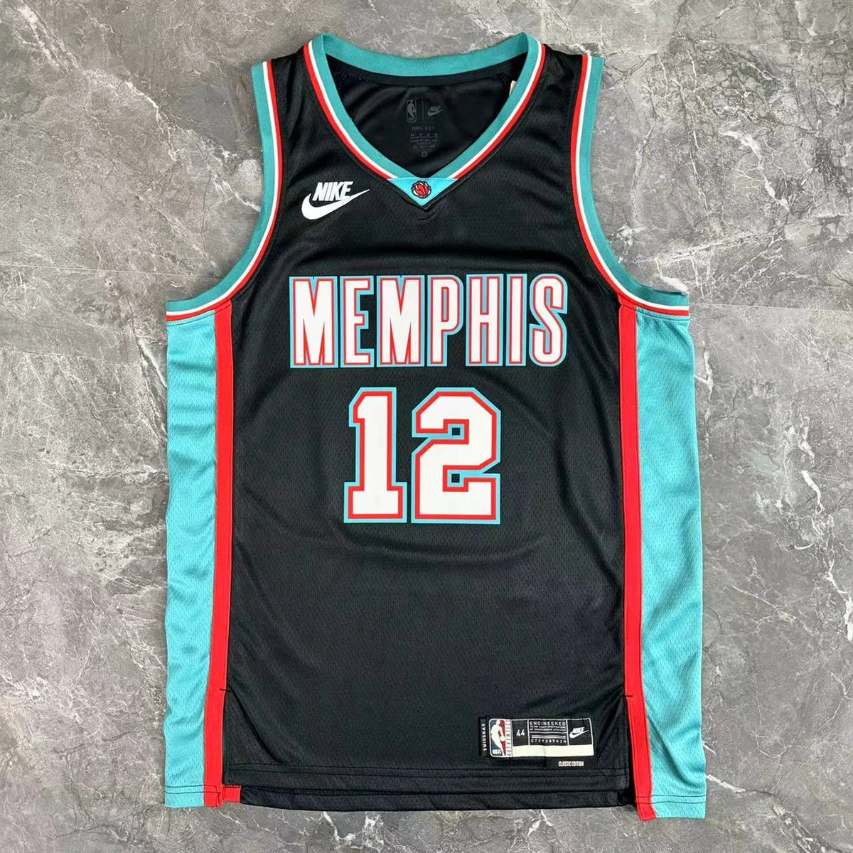 Memphis Grizzlies 2025-26 throwback edition basketball jersey close-up of team logo embroidery in team colors for basketball fans